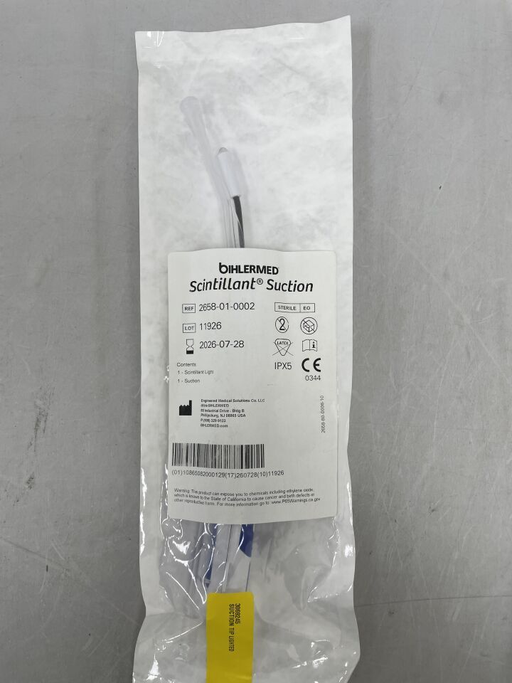 Sterile packaged medical suction device with tube, BIHLERMED Scintillant Suction, on gray background
