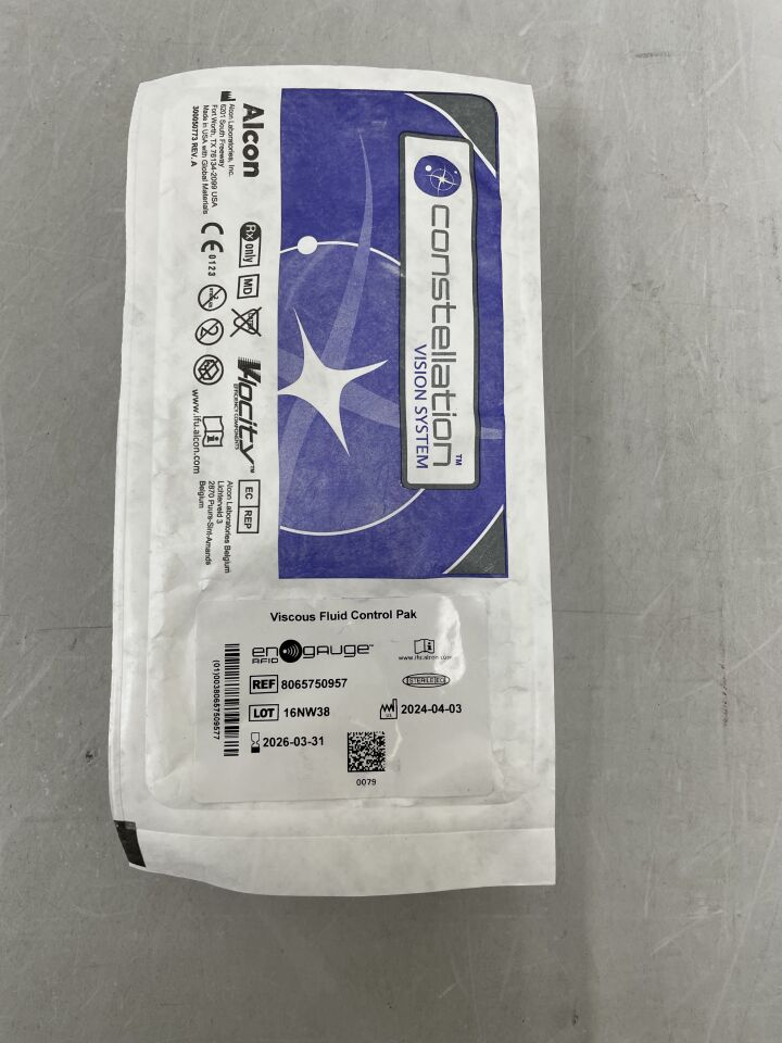 Constellation Vision System Viscous Fluid Control Pak medical supply in sealed packaging on gray surface
