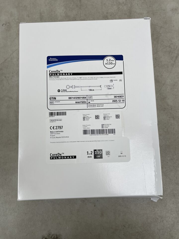 CoreDx pulmonary mini-forceps 1.2mm x 130cm medical device box on gray surface